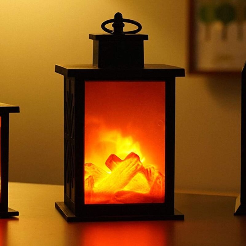 Farol de chimenea tradicional y cálido elaborado con una lámpara de mesa LED estilo carbón, con un efecto de llama de fuego realista.