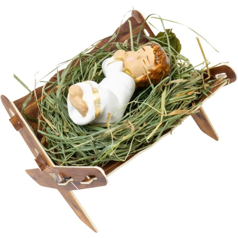 Handbemalte Figur des Jesuskindes in einer Krippe mit Heu. Perfekt für eine Weihnachtskrippe.